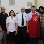Religious leaders serve Christmas lunch to disadvantaged community